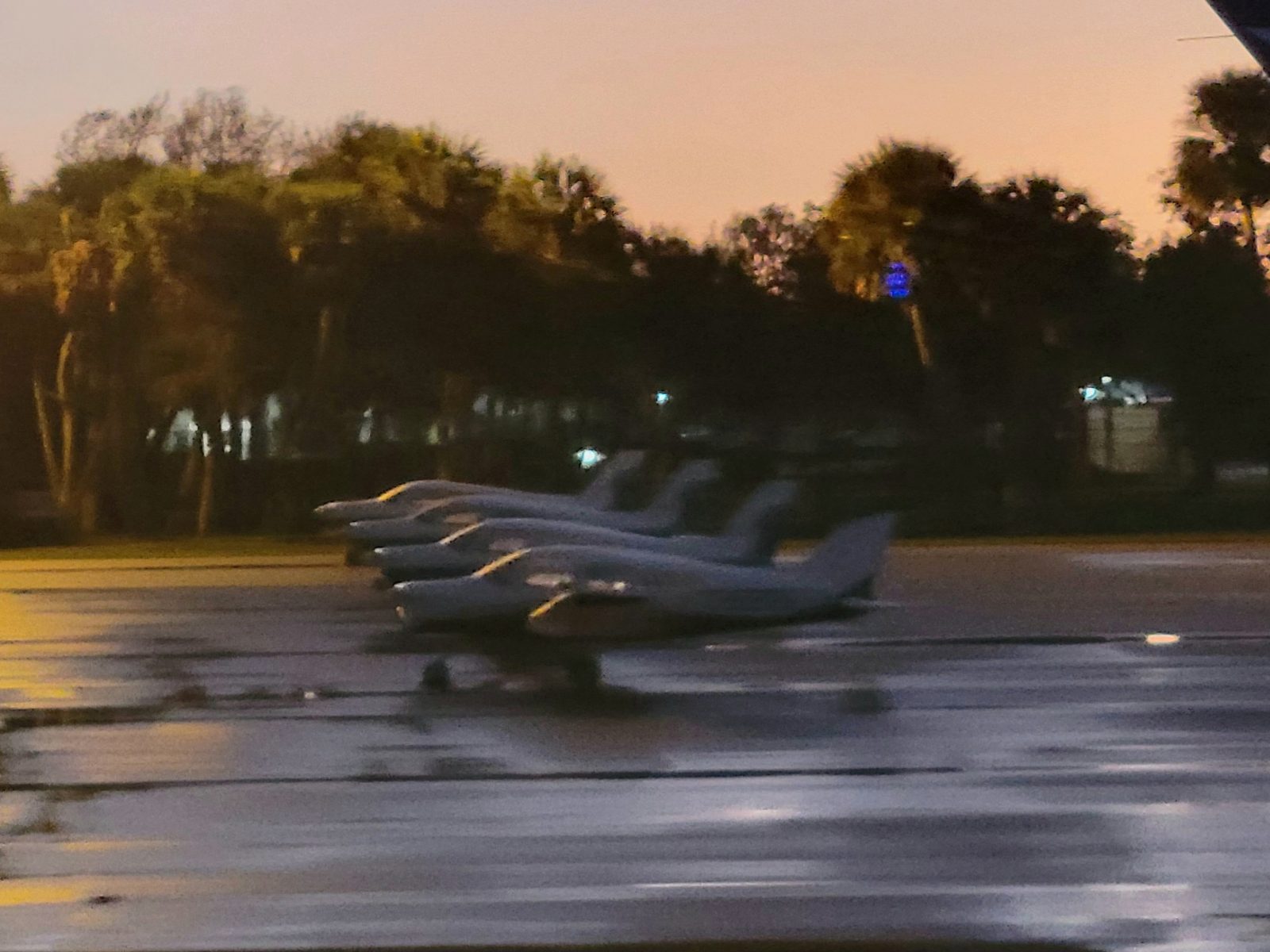 Piper aircraft parked at Vero Beach Regional Airport at dusk.